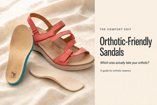 A pair of tan leather Revere sandals with the footbed lifted out, beside a foot orthotic, on a warm neutral background